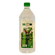 Stor plastflaska med ättika, vit vinäger 1000 ml, grön etikett och grön kork.