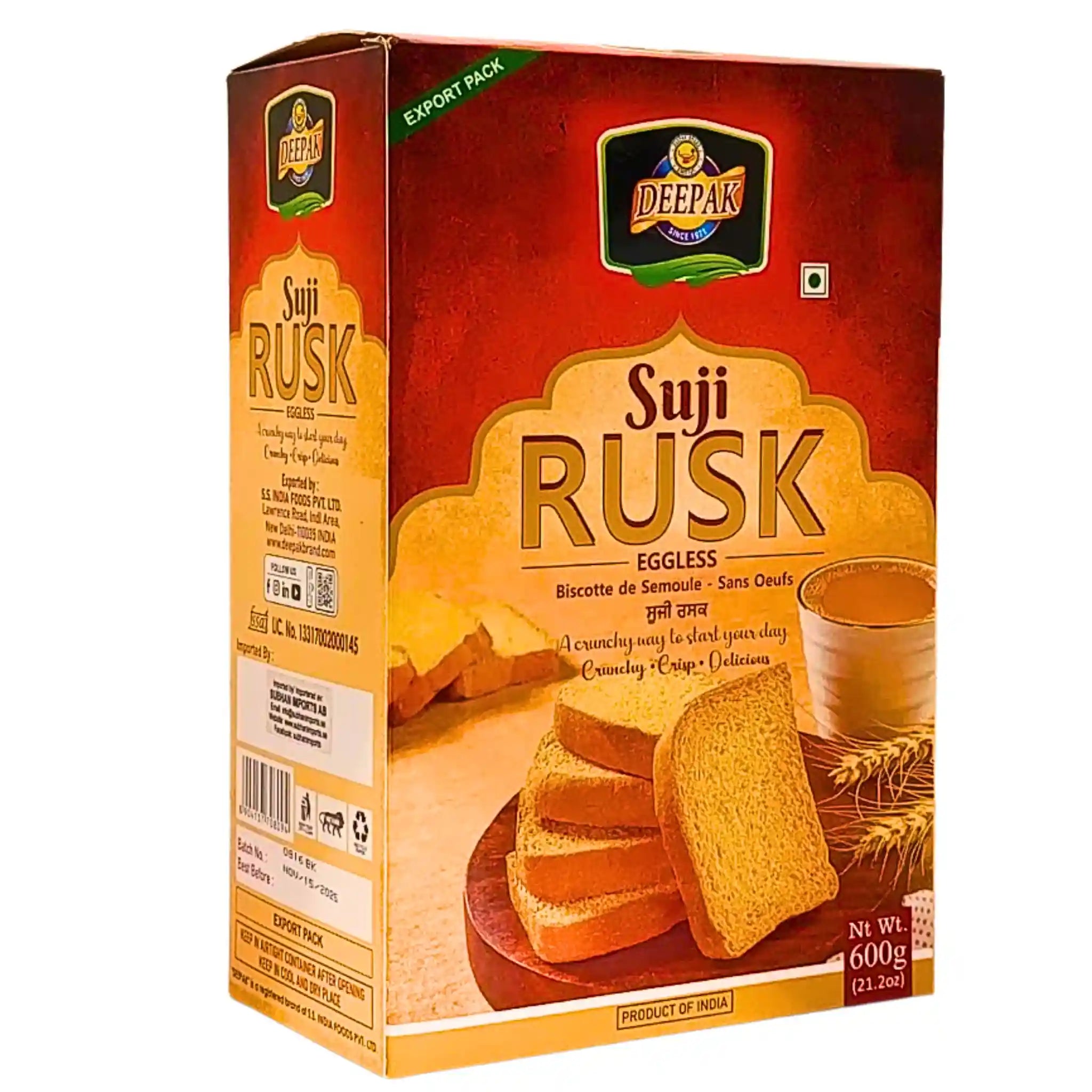 Deepak Suji Rusk 600g kartong, skivor av knäckebröd utan ägg, te och vetestrån mot vit bakgrund