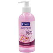 Flytande tvål med doft av vildros, rosa flaska med pump, blomdesign på etiketten.