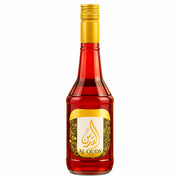 Flaska granatäpplekoncentrat Al Quds med guldkork och röd vätska, 600 ml