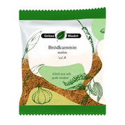 Förpackning med malen brödkummin, gröna växtillustrationer och grön etikett, 40g.