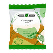 Påse med mald kryddpeppar, grönt och vitt förpackning, teckningar av grönsaker.