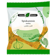 Förpackning med mald spiskummin, orientaliskt krydda, tecknade växter och örter på etiketten.