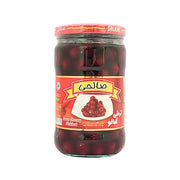 Glasburk med inlagda surkörsbär, röd etikett med körsbärsbild, orientalisk produkt.