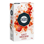 Jozo jodsalt i kartong, 1 kg, med orange saltkristaller på framsidan